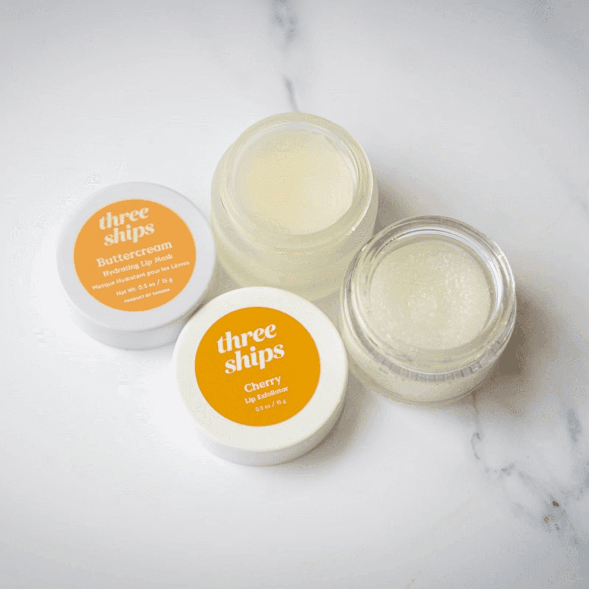 Two honey balm tins