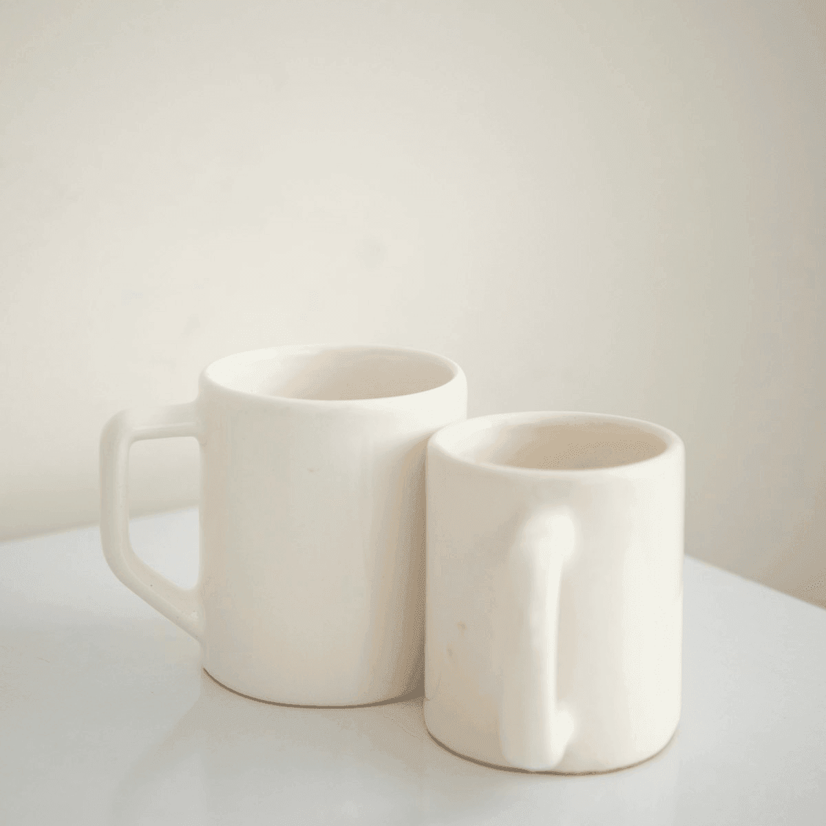 Two speckled ceramic mugs